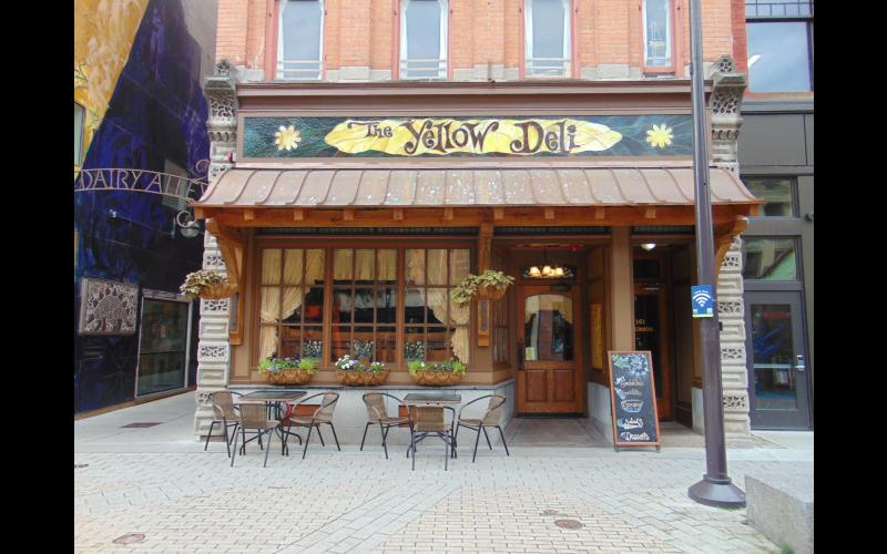 Deli entrance with outdoor seating (weather permitting).